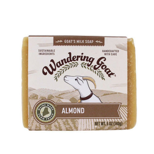 A bar of almond goat milk soap by wandering goat with a white background,
