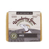 A bar of anise goat milk soap by wandering goat on a white background.